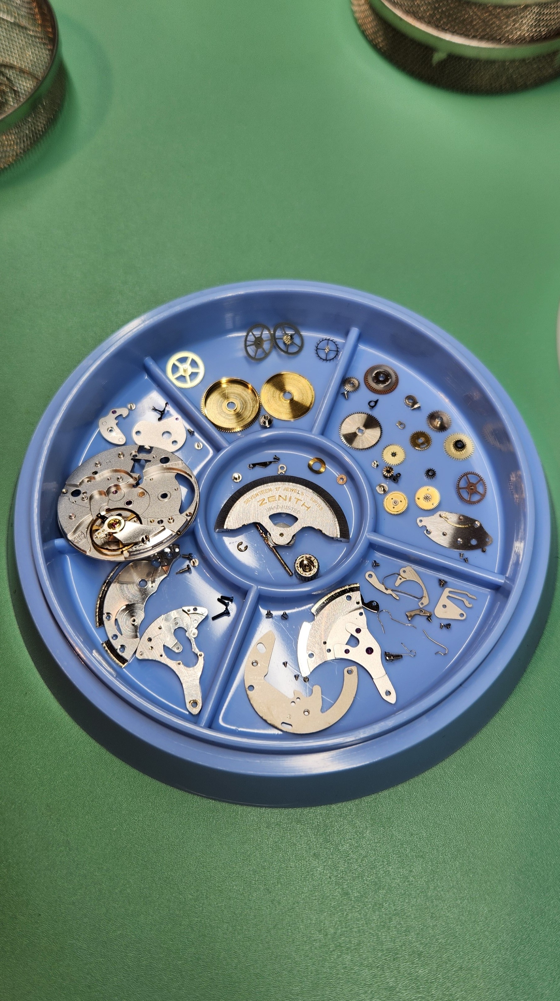 Mechanical watch movement being serviced